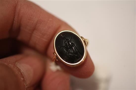 A Roman green chalcedony intaglio in a later gold ring mount, size C.